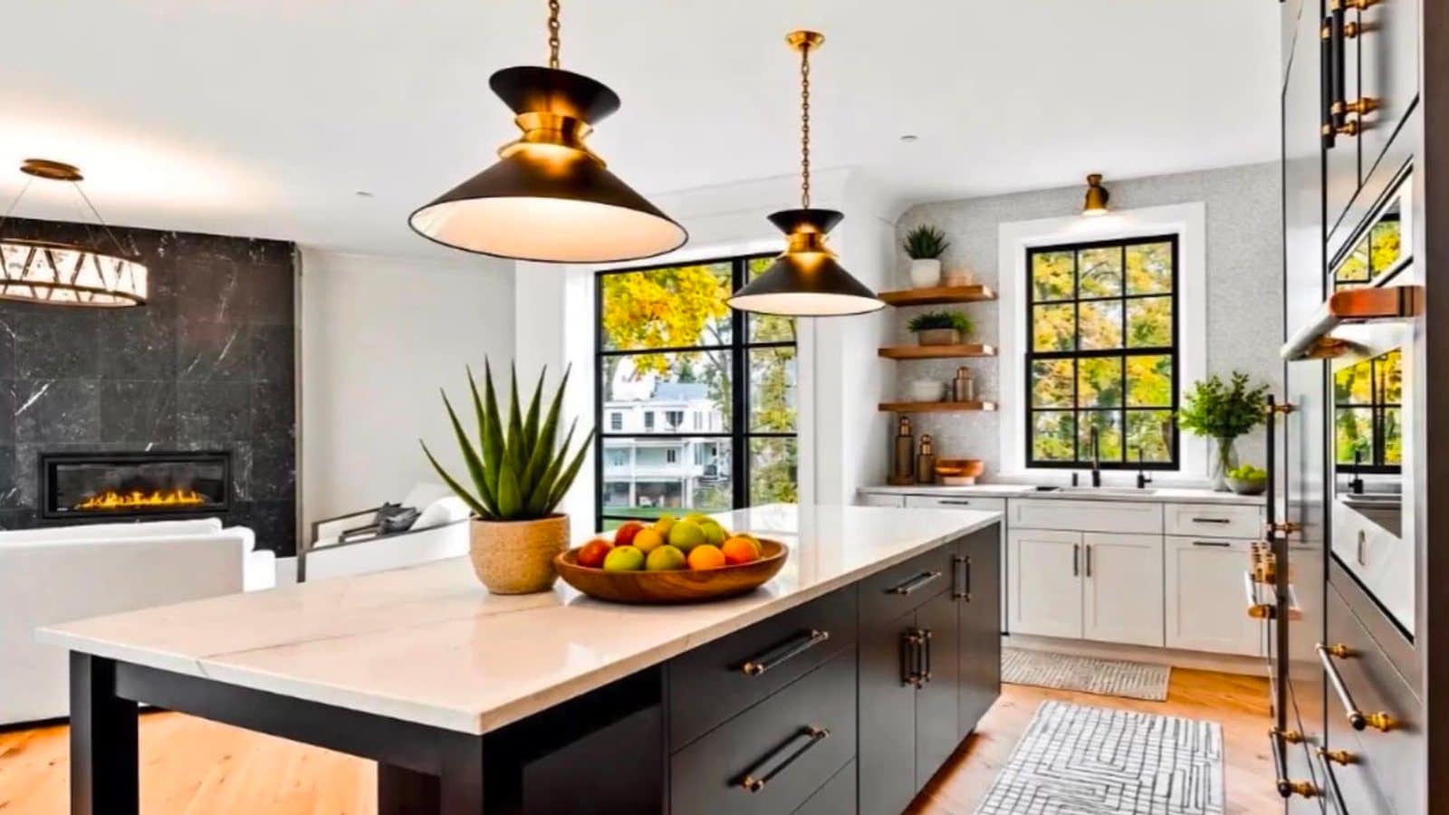 A renovated luxury kitchen with natural stone counters and custom cabinetry in a Bucks County home